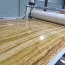 SPC石塑地板生产线:PVC基材+彩膜+耐磨层三合一生产线